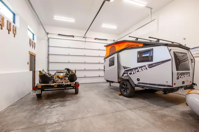 a blue and white car parked in garage