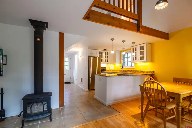 a view of a living room with furniture and a kitchen