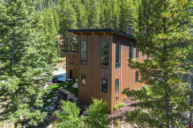 front view of a house with a tree