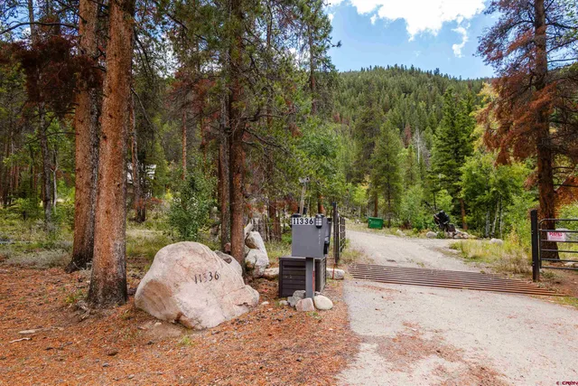 a view of a backyard with sitting area