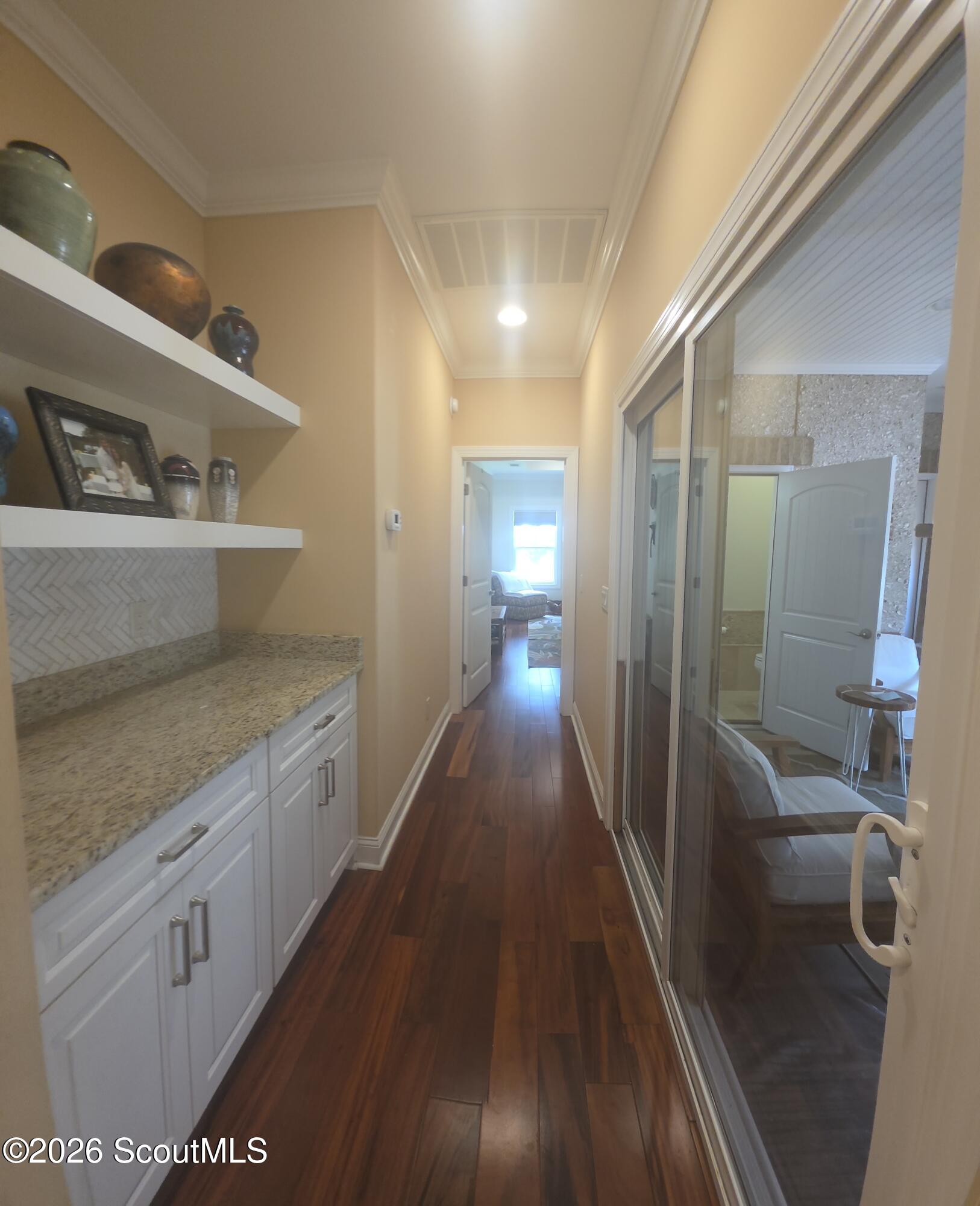 1201 Greenswamp Road Brunswick, GA 31525 - Photo 57 of 66 Hallway leading to enclosed patio & primary BR