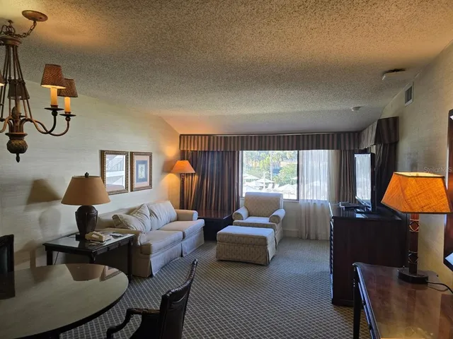 a bed room with two bed and a window