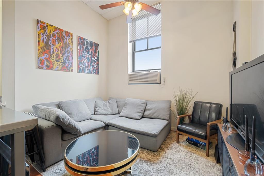 330 46th Street Pittsburgh, PA 15201 - Photo 13 of 25 a living room with furniture and a window
