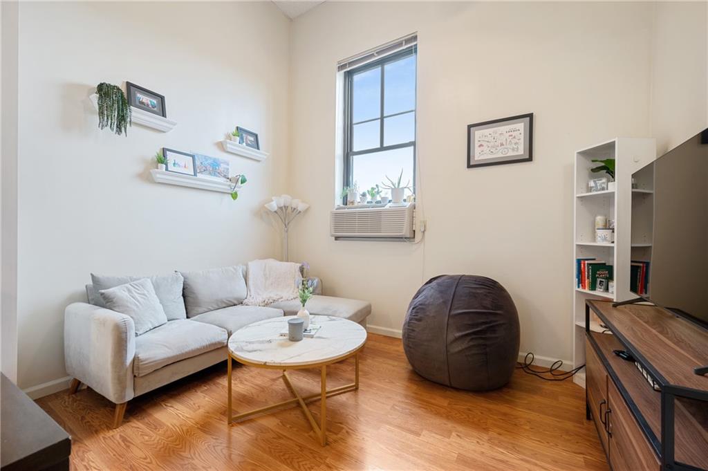 330 46th Street Pittsburgh, PA 15201 - Photo 21 of 25 a living room with furniture and a flat screen tv