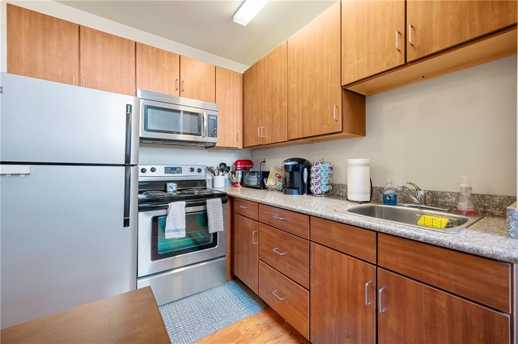 330 46th Street Pittsburgh, PA 15201 - Photo 22 of 25 a kitchen with stainless steel appliances granite countertop a refrigerator sink and stove