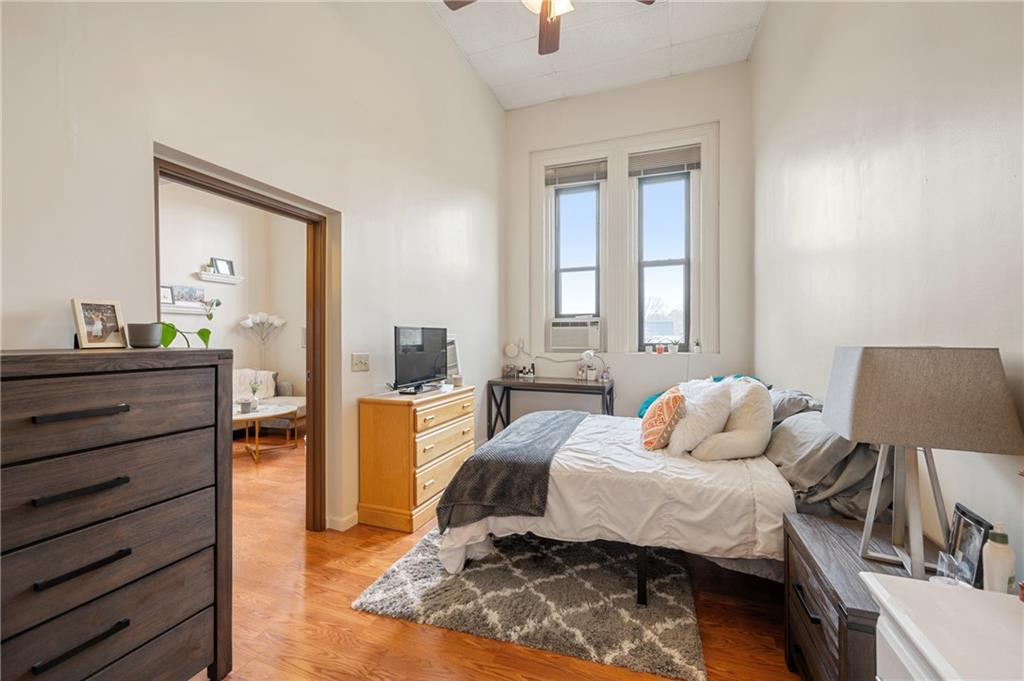 330 46th Street Pittsburgh, PA 15201 - Photo 23 of 25 a bedroom with a bed and wooden floor