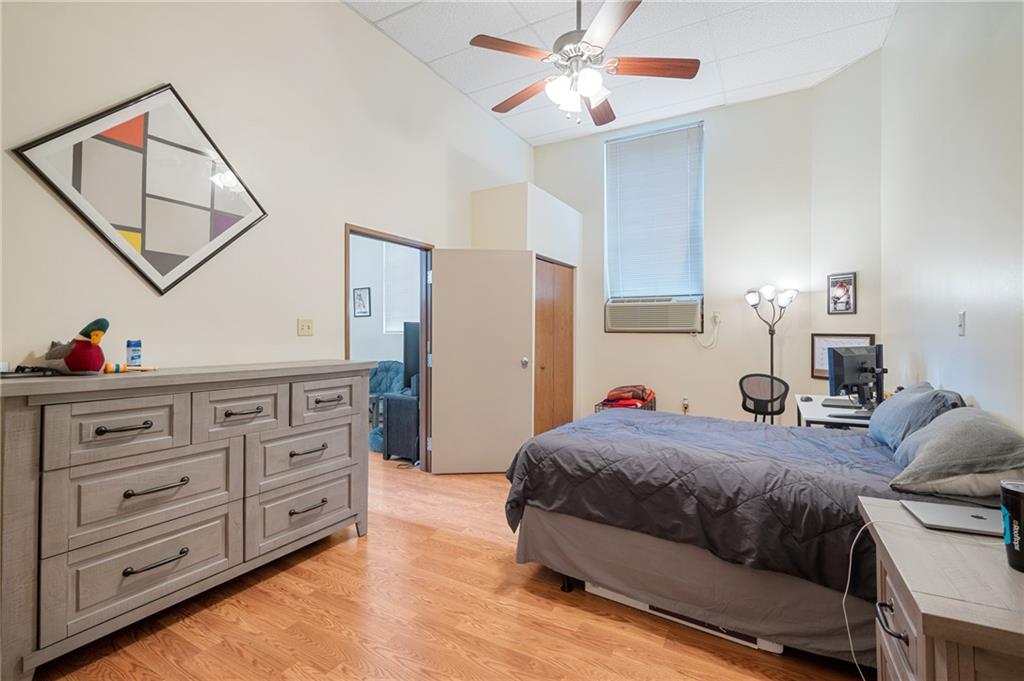 330 46th Street Pittsburgh, PA 15201 - Photo 6 of 25 a bedroom with a bed and a chandelier