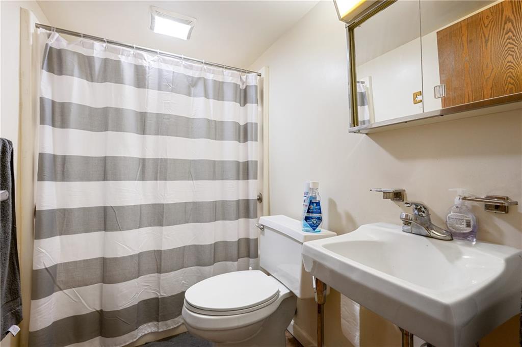 330 46th Street Pittsburgh, PA 15201 - Photo 7 of 25 a bathroom with a sink toilet and shower