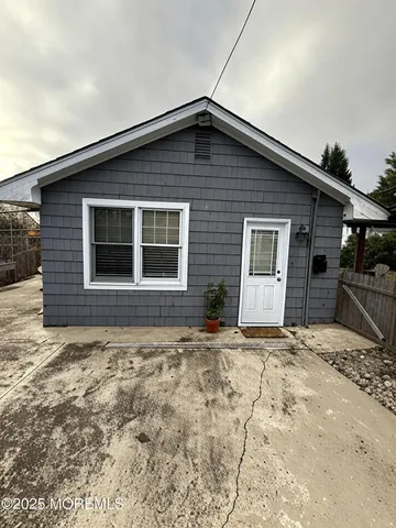 a house with trees in the background