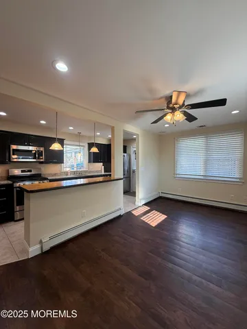 a view of a kitchen with a dishwasher and cabinets
