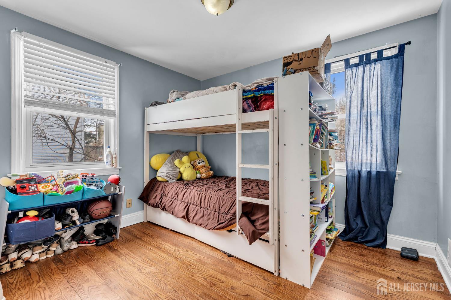 821 Front Street Dunellen, NJ 08812 - Photo 11 of 17 a bedroom with a bed and a window