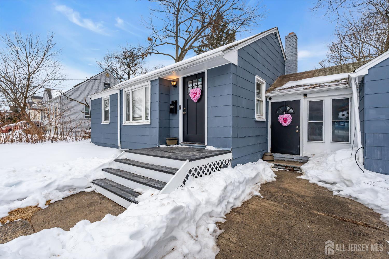 821 Front Street Dunellen, NJ 08812 - Photo 2 of 17 a view of a house with snow on the road
