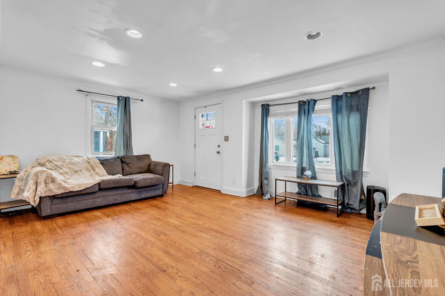 821 Front Street Dunellen, NJ 08812 - Photo 3 of 17 a living room with furniture and a wooden floor