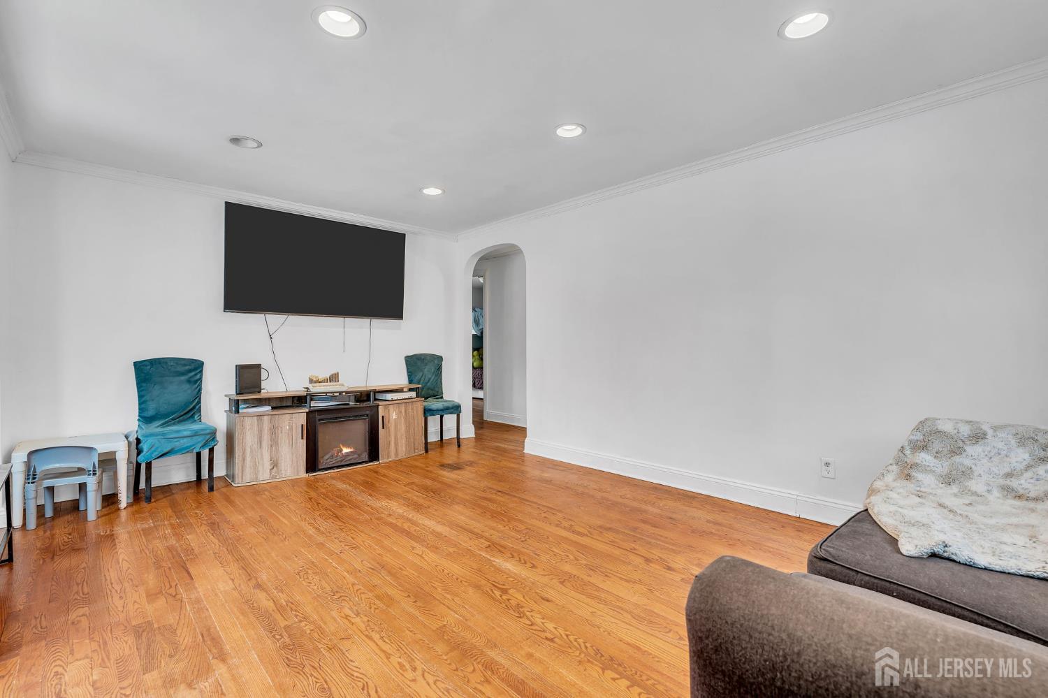 821 Front Street Dunellen, NJ 08812 - Photo 4 of 17 a living room with furniture and a flat screen tv