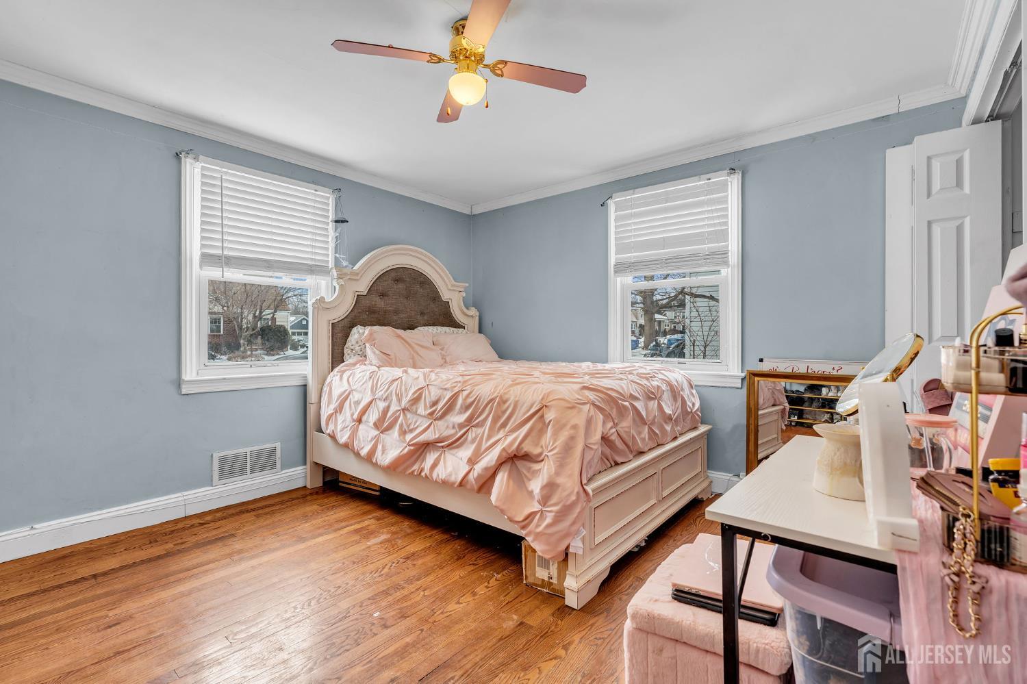 821 Front Street Dunellen, NJ 08812 - Photo 10 of 17 a bedroom with a bed and a window