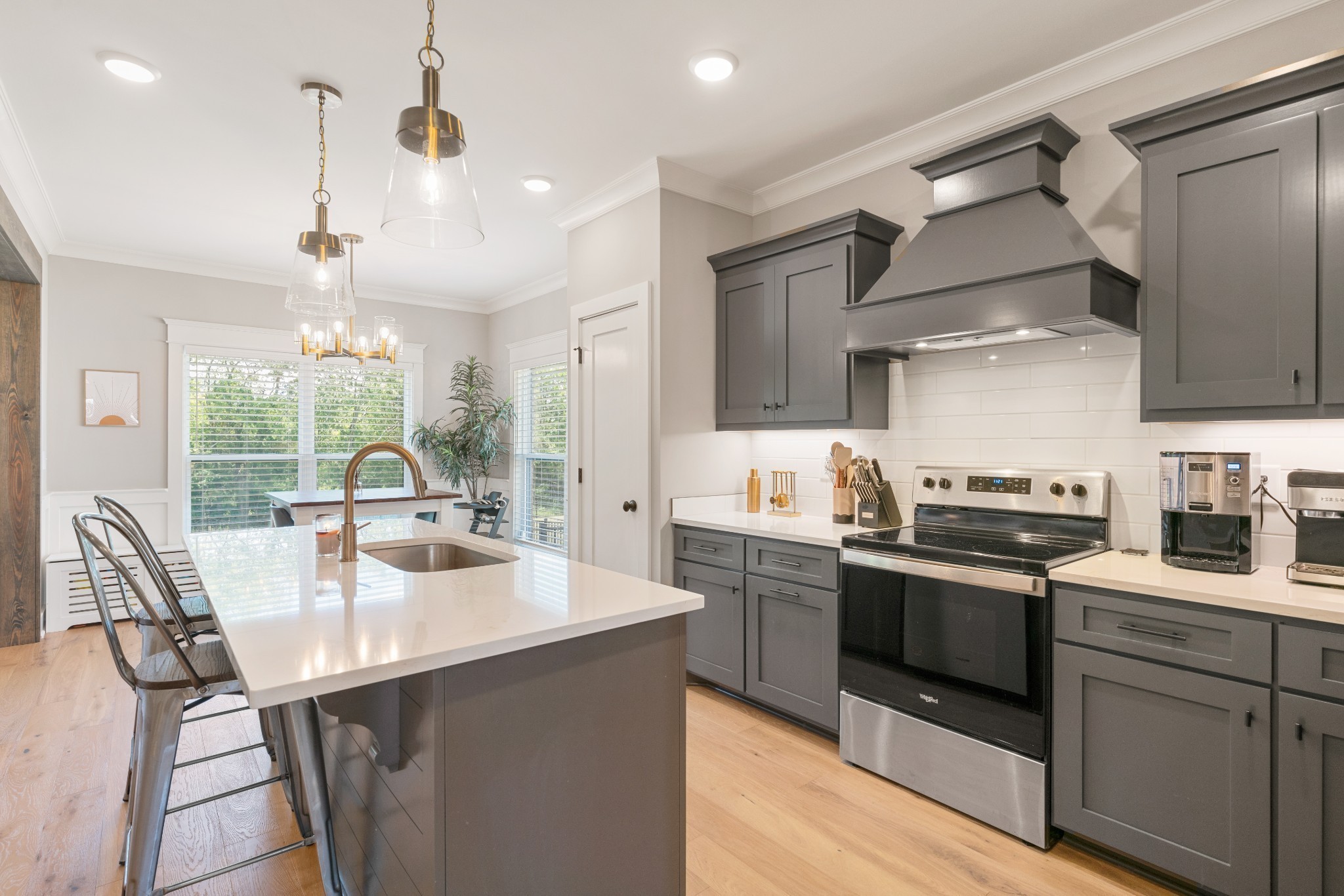 2774 Jasmine Street Lebanon, TN 37087 - Photo 13 of 47 a kitchen with stainless steel appliances granite countertop a sink stove and refrigerator