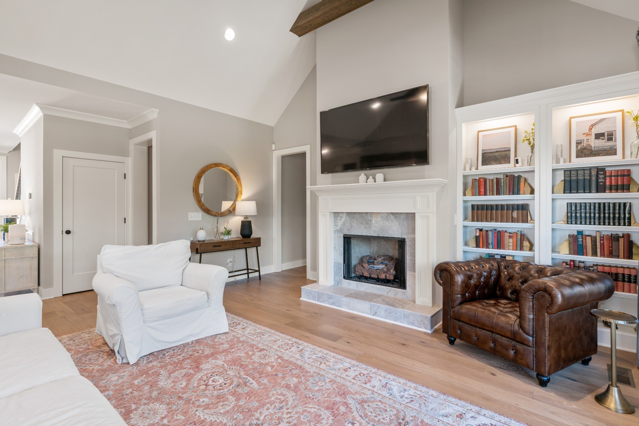 2774 Jasmine Street Lebanon, TN 37087 - Photo 5 of 47 a living room with furniture a flat screen tv and a fireplace
