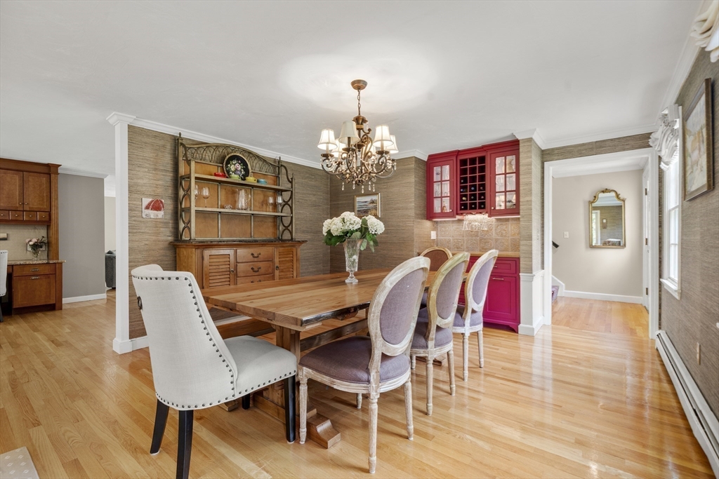30 Franklin Rodgers Road Hingham, MA 02043 - Photo 9 of 37 a dining room with furniture a chandelier and wooden floor