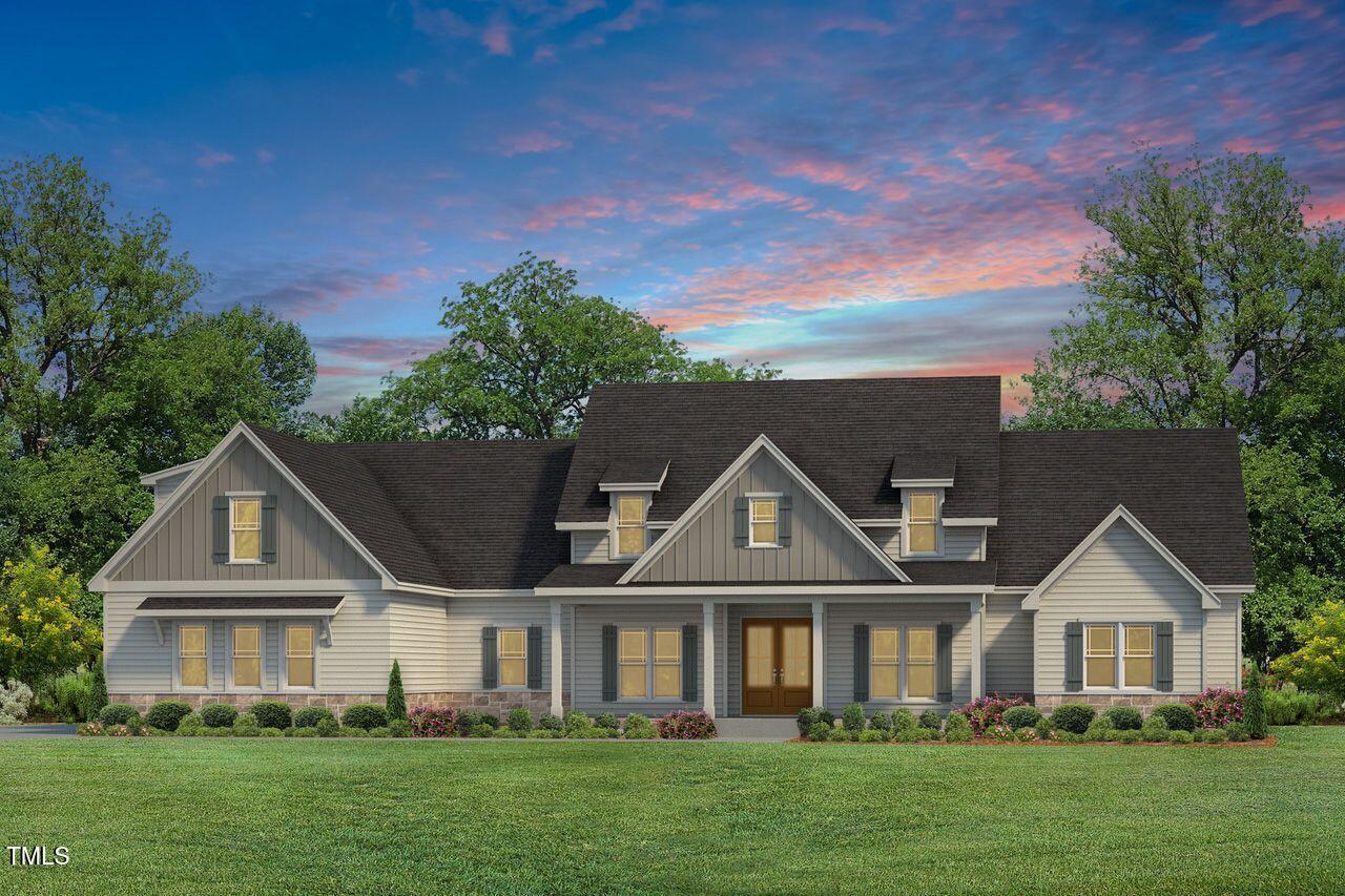 85 Old Gdn Lane Youngsville, NC 27596 - Photo 2 of 17 front view of a house with a yard