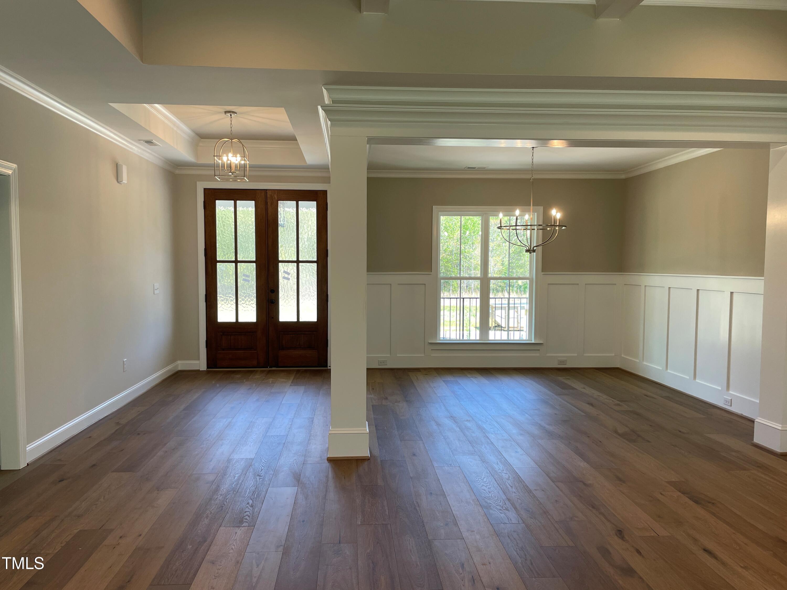 85 Old Gdn Lane Youngsville, NC 27596 - Photo 5 of 17 a view of an empty room with wooden floor and a window