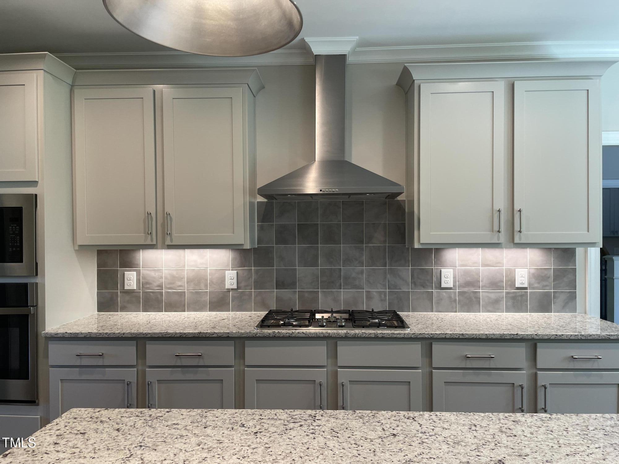 85 Old Gdn Lane Youngsville, NC 27596 - Photo 7 of 17 a kitchen with granite countertop a stove sink and cabinets