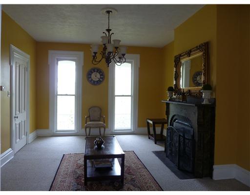 965 Tuscarawas Road Beaver, PA 15009 - Photo 3 of 18 Living Room. Ornate, decorative fireplace graces this spacious, inviting living room. Note the floor to ceiling windows that are original to the home! Door on left leads to foyer with grand staircase and front entrance.