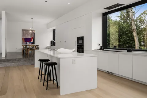 a view of kitchen island with furniture and wooden floor