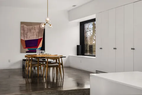 a view of a hallway with seating area