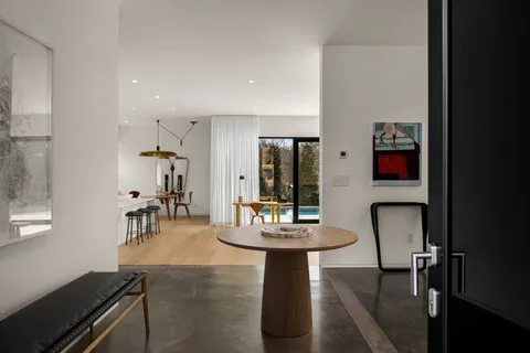 a living room with furniture and a table