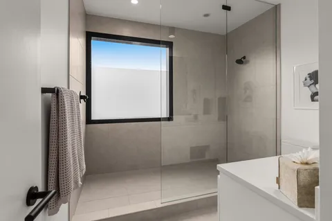 a bathroom with a tub and shower