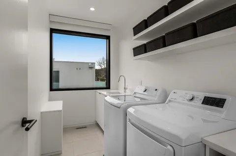 a bedroom with bed and a flat screen tv