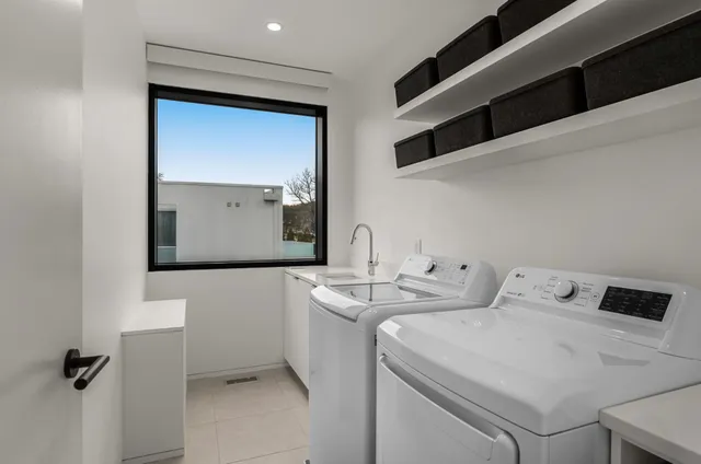 a bedroom with bed and a flat screen tv