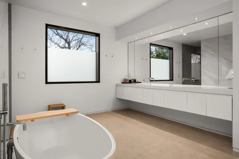 a bathroom with a bathtub and a shower