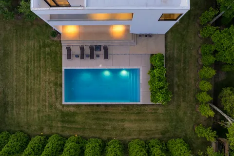an aerial view of a house with a garden