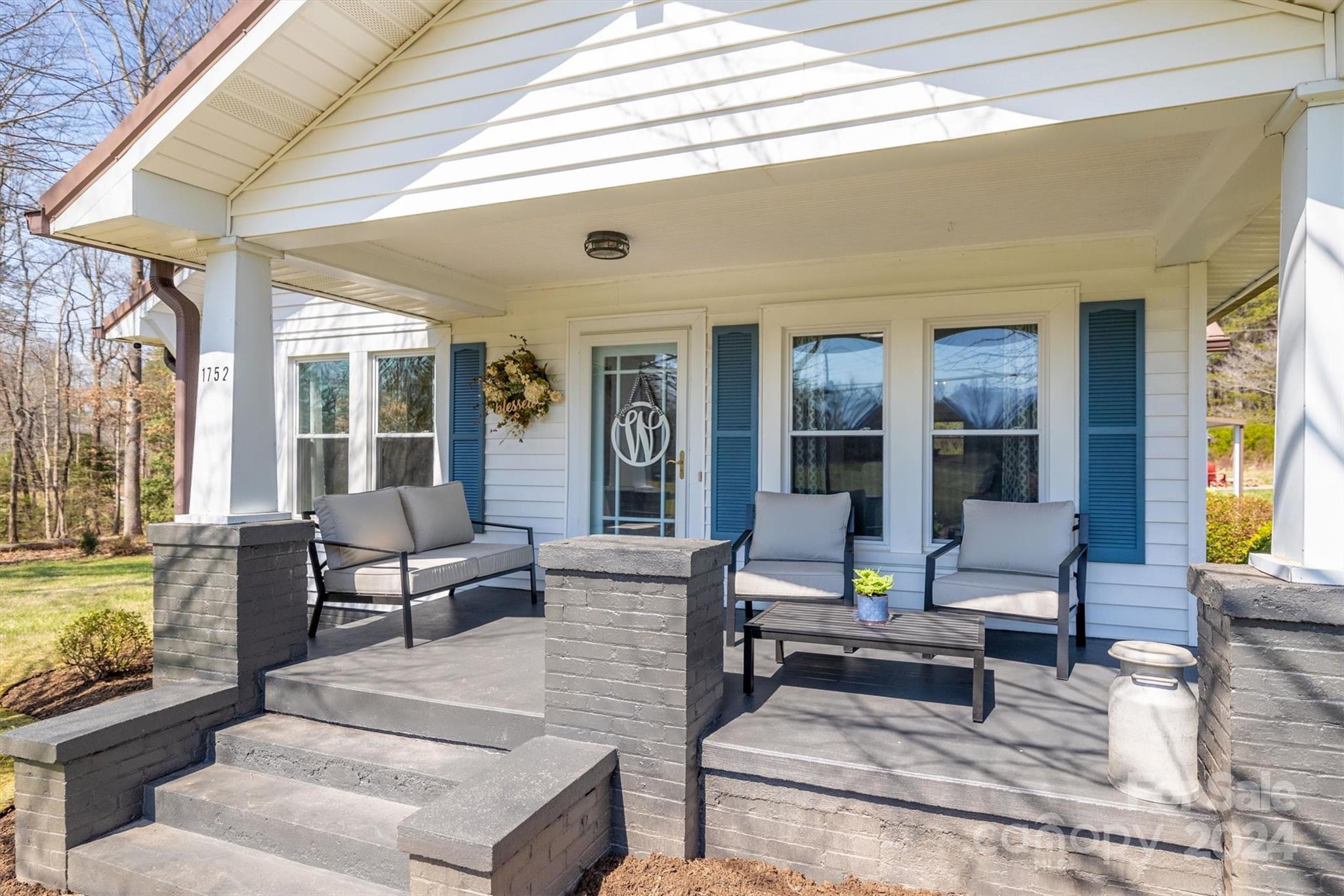 1752 Bethel Road Morganton, NC 28655 - Photo 3 of 34 a living room with furniture and floor to ceiling windows