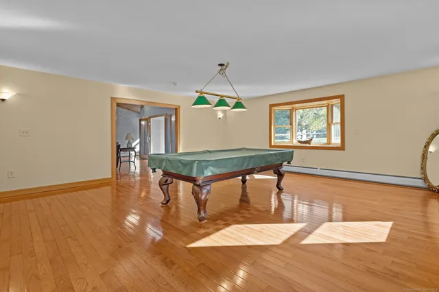 a living room with furniture a table and a potted plant