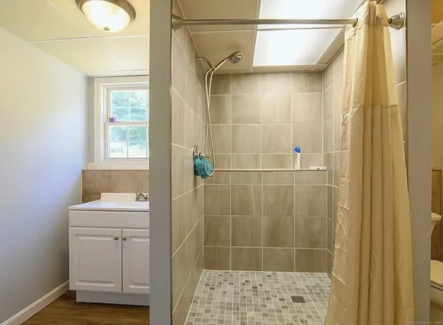 a bedroom with bed and a walk in closet