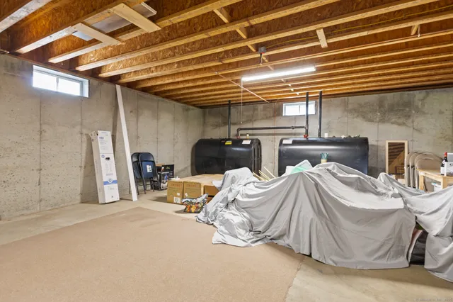 a view of a big house with a big yard and large trees