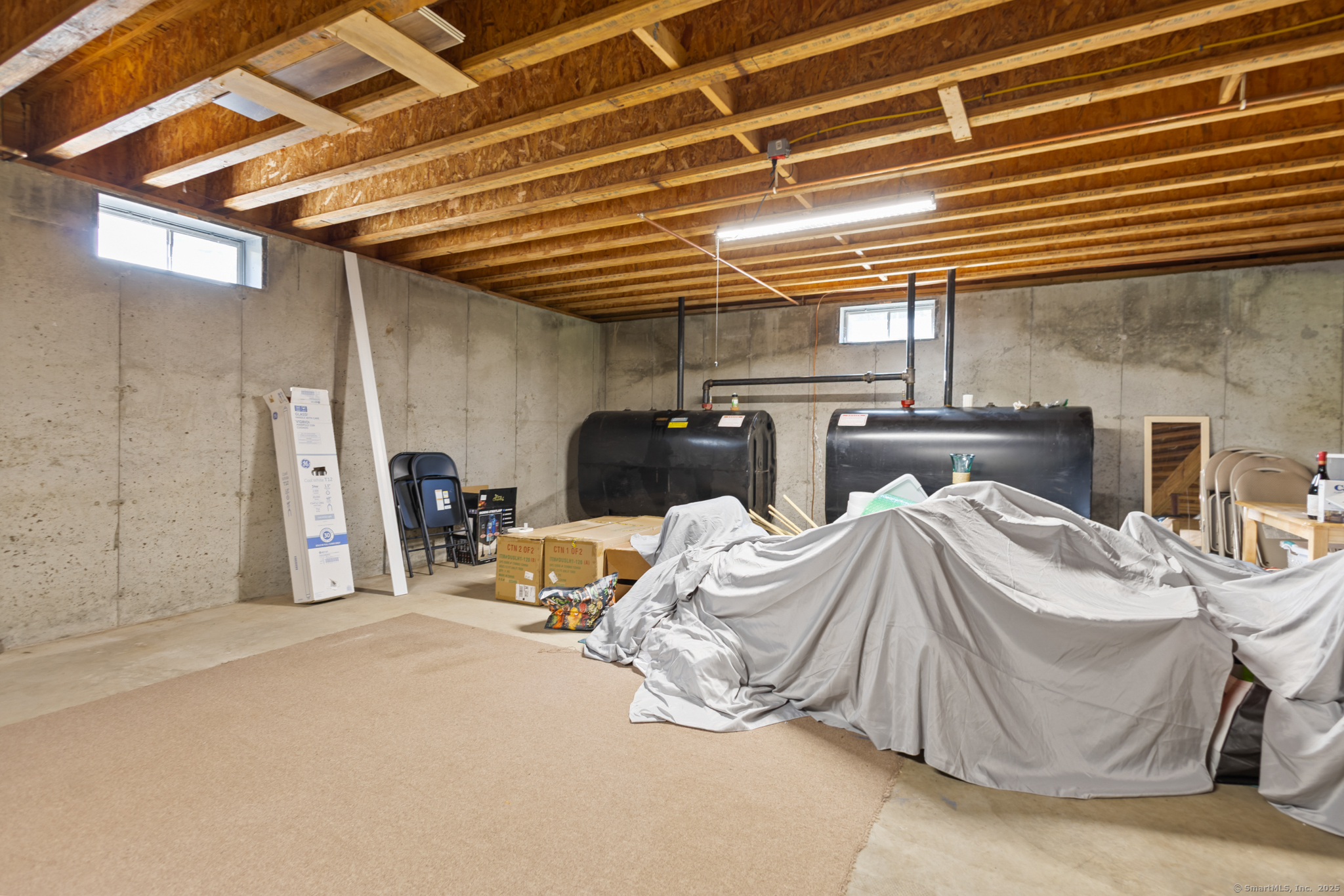 679 Bailey Hill Road Killingly, CT 06241 - Photo 35 of 39 a bedroom with bed and a walk in closet