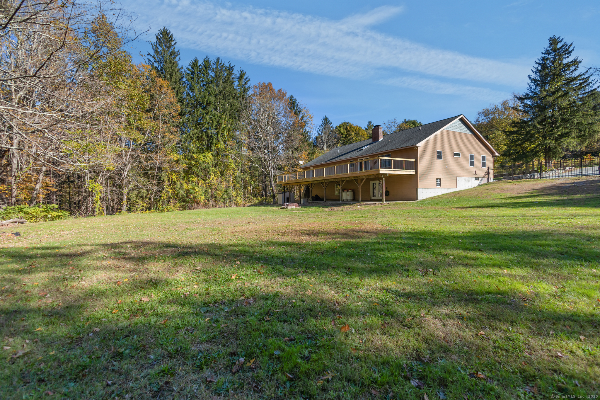 679 Bailey Hill Road Killingly, CT 06241 - Photo 37 of 39 a view of a big house with a big yard and large trees