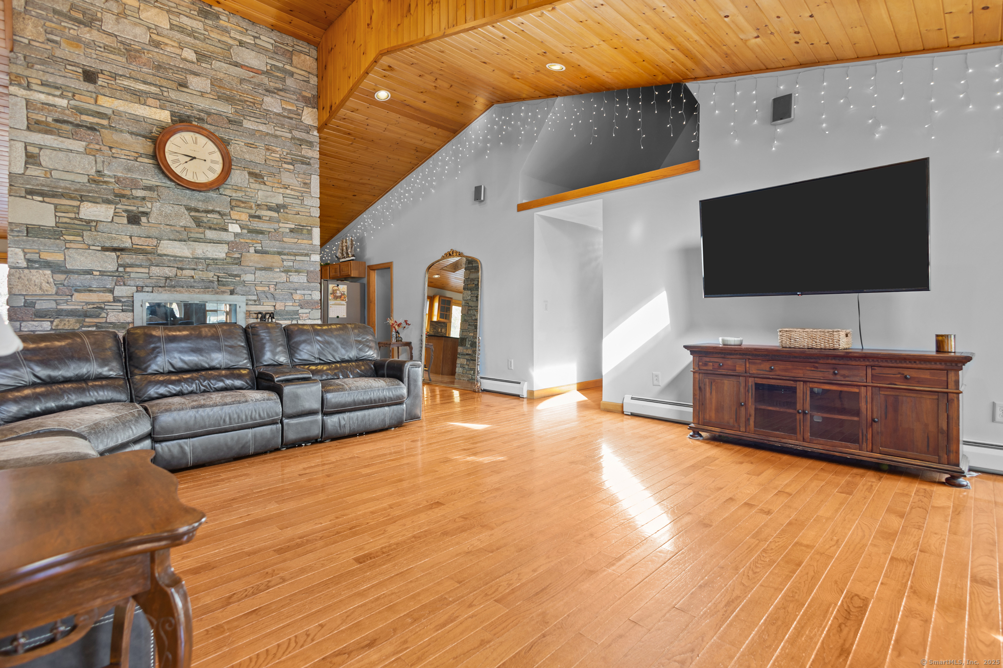 679 Bailey Hill Road Killingly, CT 06241 - Photo 8 of 39 a living room with furniture and a flat screen tv