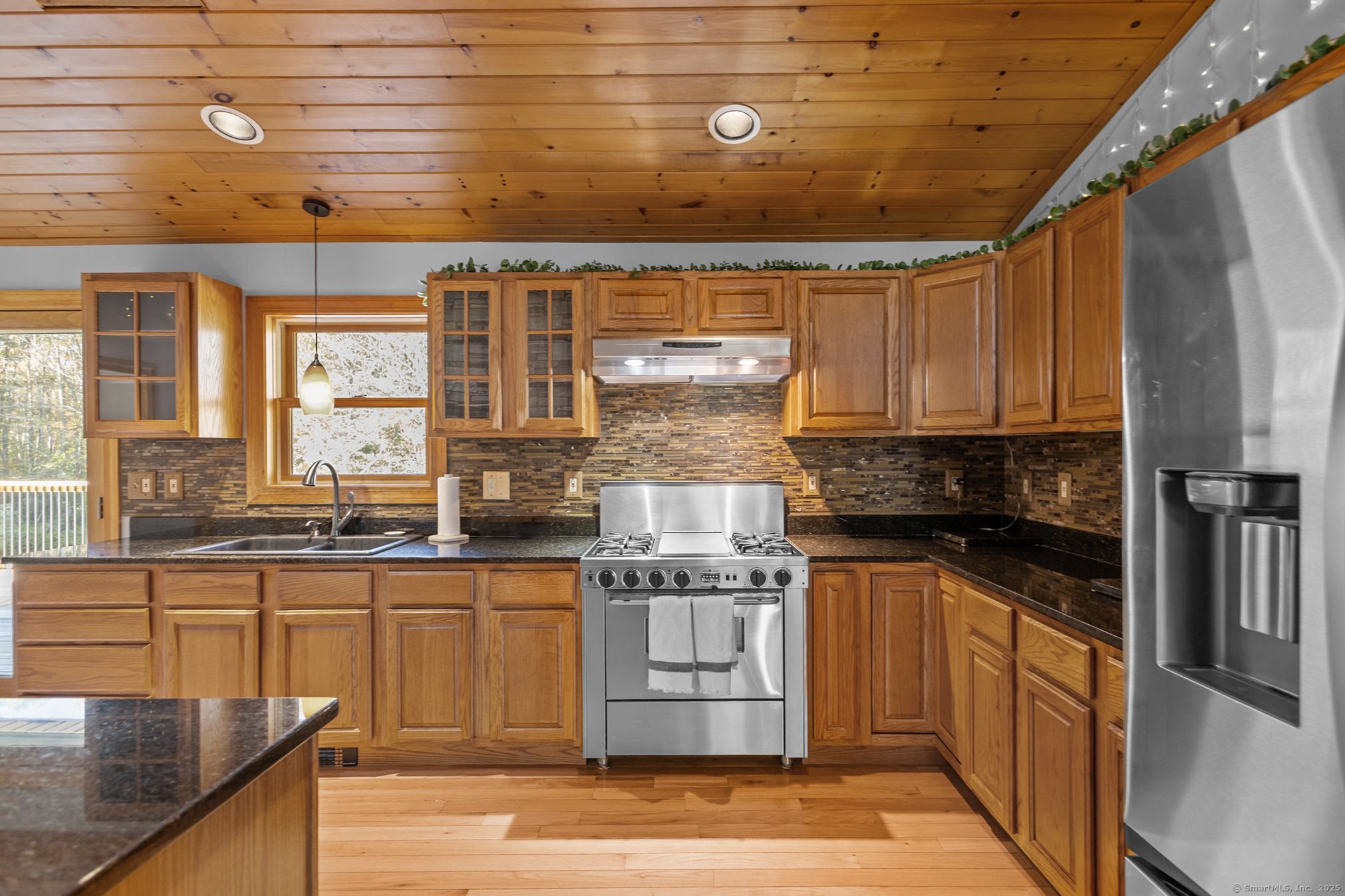 679 Bailey Hill Road Killingly, CT 06241 - Photo 10 of 39 a kitchen with stainless steel appliances granite countertop a stove and a refrigerator