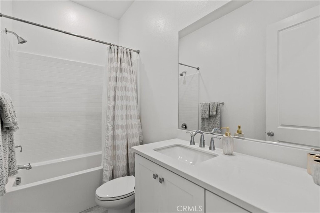 27410 Merlin Place, Unit 305 Valencia, CA 91381 - Photo 11 of 32 a bathroom with a sink toilet and shower