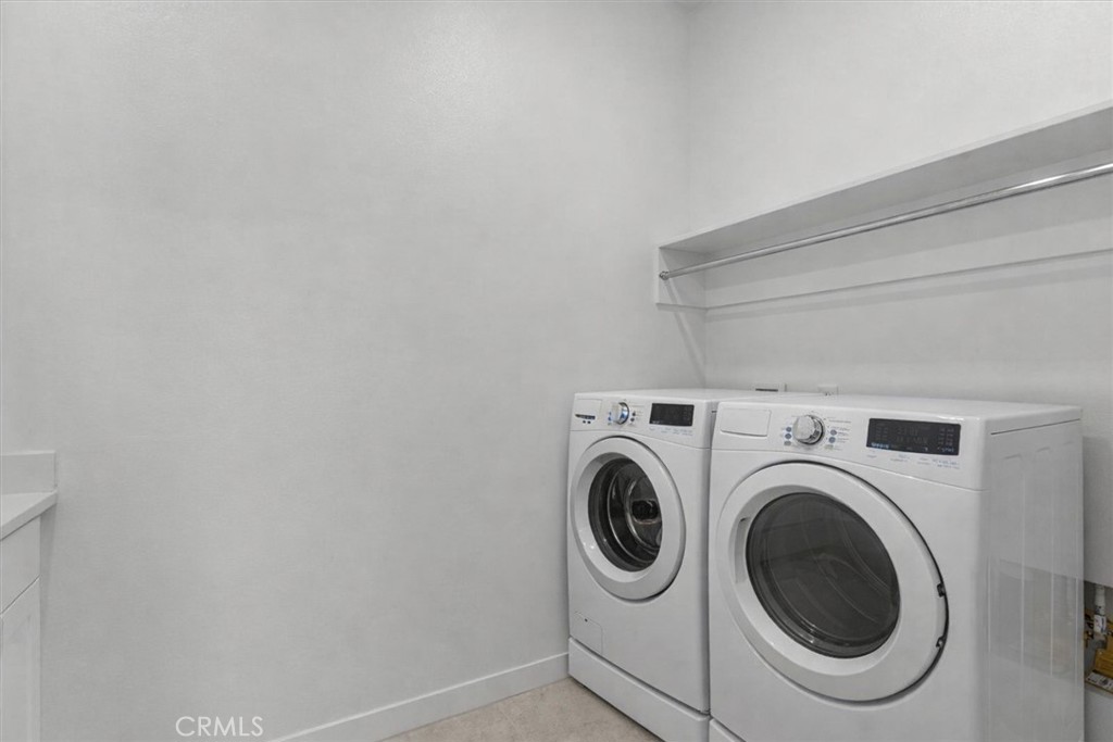 27410 Merlin Place, Unit 305 Valencia, CA 91381 - Photo 19 of 32 a utility room with dryer and washer