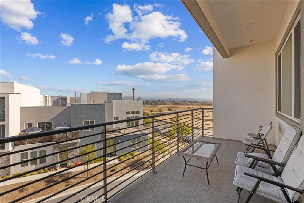 27410 Merlin Place, Unit 305 Valencia, CA 91381 - Photo 20 of 32 a view of a balcony with chairs