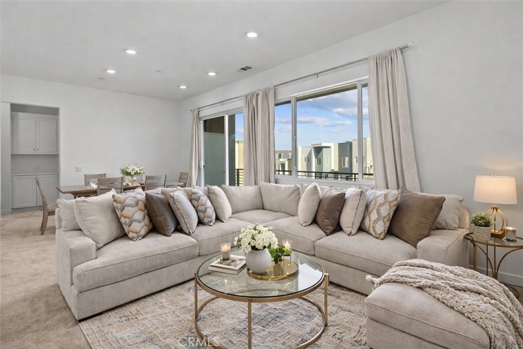 27410 Merlin Place, Unit 305 Valencia, CA 91381 - Photo 2 of 32 a living room with furniture and a large window