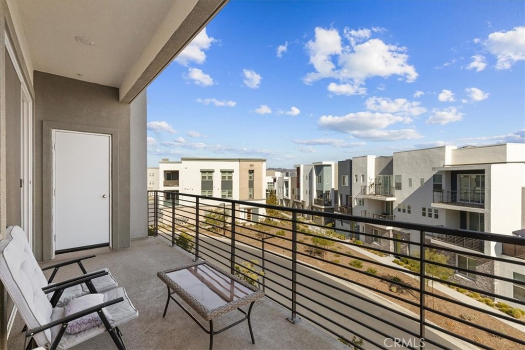 27410 Merlin Place, Unit 305 Valencia, CA 91381 - Photo 21 of 32 a view of a balcony with chairs