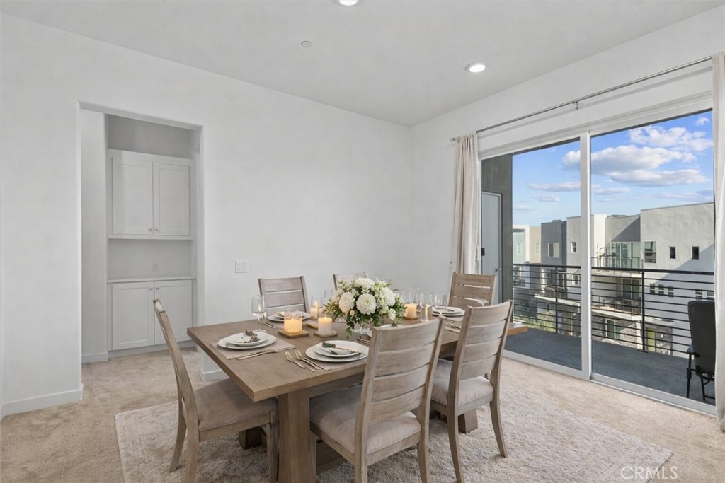 27410 Merlin Place, Unit 305 Valencia, CA 91381 - Photo 5 of 32 a view of a dining room with furniture window and outside view