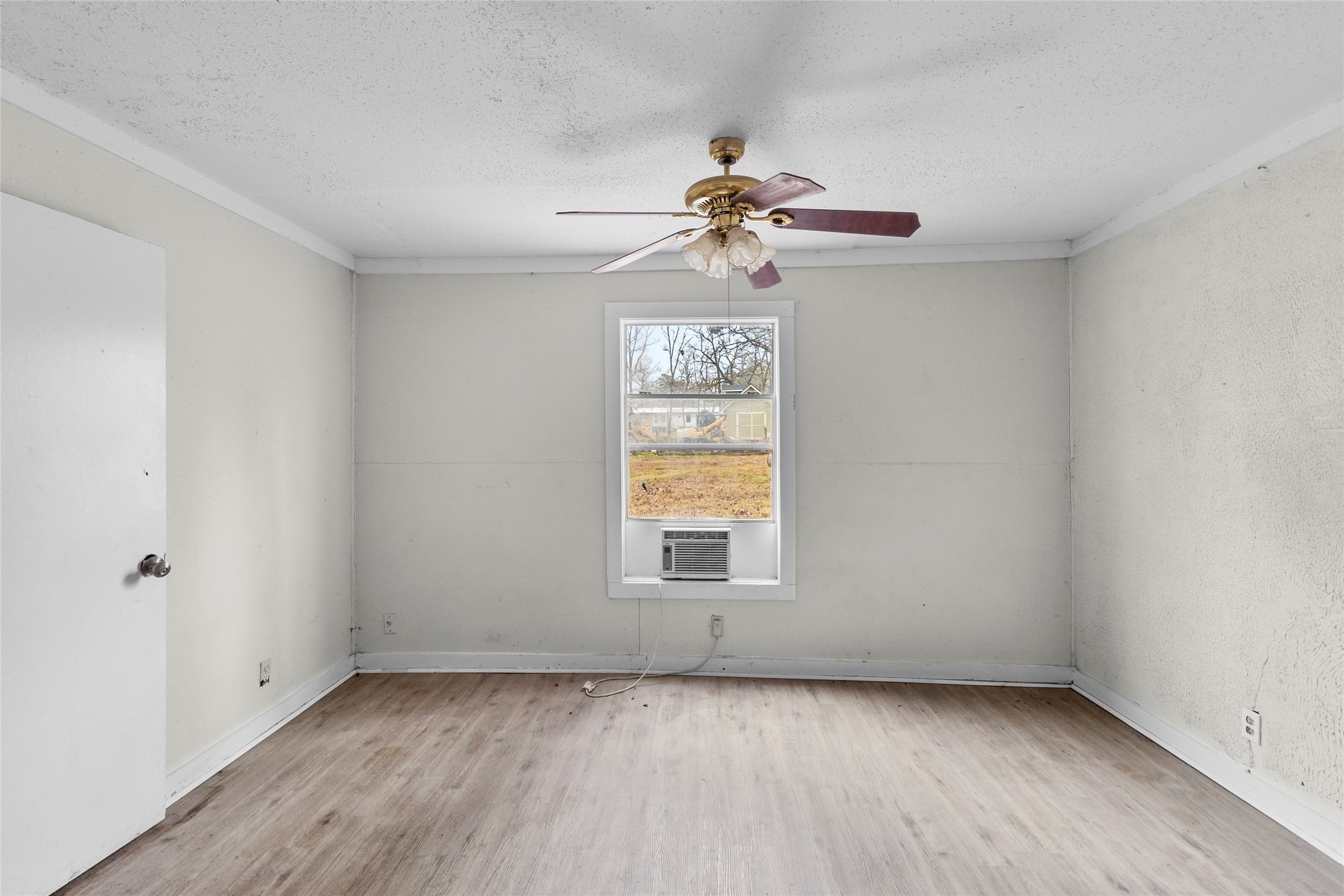 31C Jackson Road, Unit B Huntsville, TX 77320 - Photo 15 of 18 wooden floor in an empty room with a window