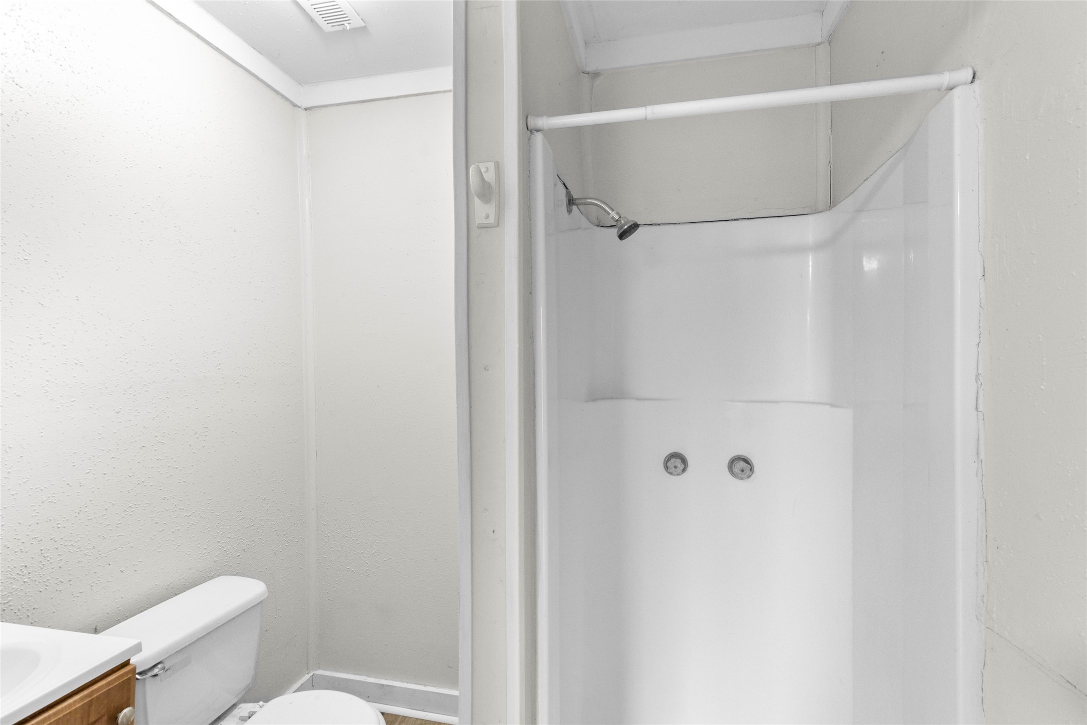 31C Jackson Road, Unit B Huntsville, TX 77320 - Photo 9 of 18 a bathroom with a toilet and a shower